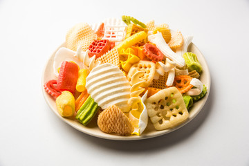 Snack pellets are non-expanded products made with raw materials like cereals, potatoes or vegetable powders, later processed using frying, hot air baking. multicoloured / shaped ready-to-eat snacks