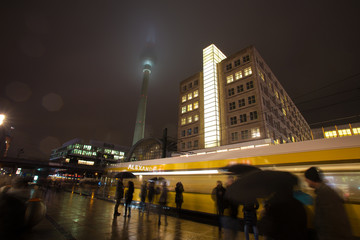 alexanderplatz berlin at night in the rain