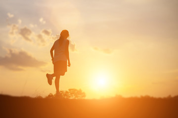 strong confidence woman open arms under the sunset.