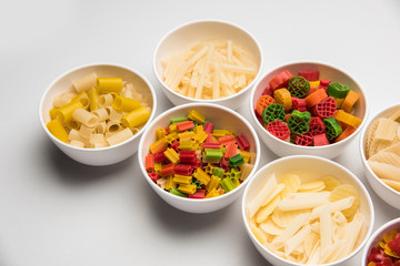 Snack pellets are non-expanded products made with raw materials like cereals, potatoes or vegetable powders, later processed using frying, hot air baking. multicoloured / shaped ready-to-eat snacks