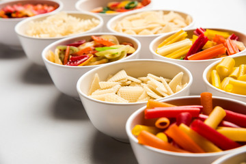 Snack pellets are non-expanded products made with raw materials like cereals, potatoes or vegetable powders, later processed using frying, hot air baking. multicoloured / shaped ready-to-eat snacks