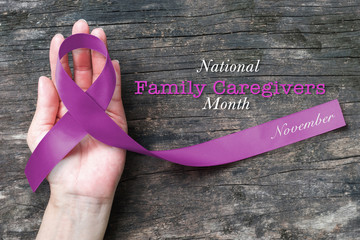 National family caregivers month in November month concept with plum purple ribbon  awareness