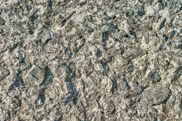 the textured stone surface or gray background