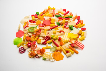 Snack pellets are non-expanded products made with raw materials like cereals, potatoes or vegetable powders, later processed using frying, hot air baking. multicoloured / shaped ready-to-eat snacks