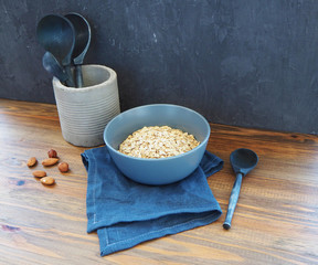 Wooden spoons on the table and in the concrete glass.
