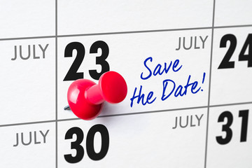 Wall calendar with a red pin - July 23
