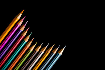 Set beautiful black, colored pencils of colored pencils on black background. Soon to school. Back to School