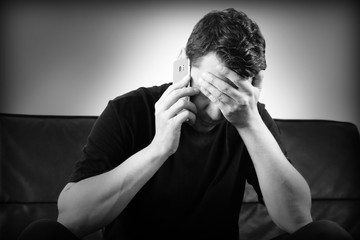 man sofa couch depressive darkness