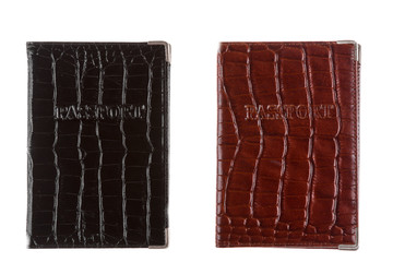 Two cover made from crocodile skin for your passport, isolated on white background. Passport on white background.