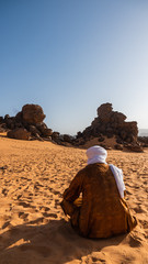 Fototapeta na wymiar Tuareg people sitting in the Sahara Desert