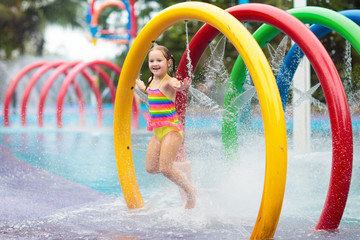 Kids at aqua park. Child in swimming pool.