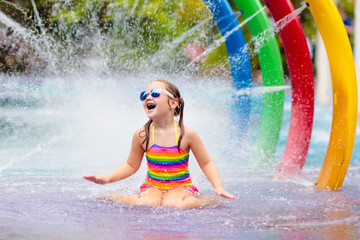 Kids at aqua park. Child in swimming pool.