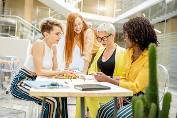 attractive cute women making up a plan how to improve sale. close up photo.competitive business