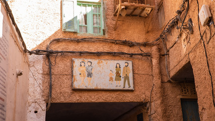 Signs for Dress Properly in desert conservative old town Ghardaia, Algeria