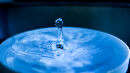 falling drop into clear water