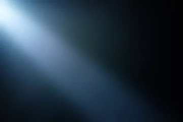 Fotobehang Light beam of light on a dark background. © evakad17