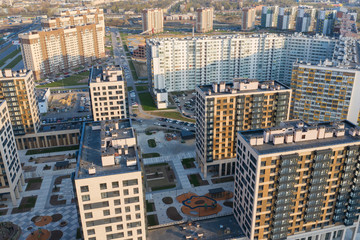view of the residential area of St. Petersburg at sunrise, modern buildings, Parking, cars, new building