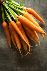 Nantes Carrots on Rustic Dark Background. Fresh Organic Superfood Healthy Eating Concept and Diabetes Control. - 268626239