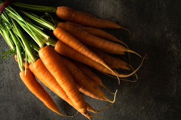 Nantes Carrots on Rustic Dark Background. Fresh Organic Superfood Healthy Eating Concept and Diabetes Control. - 268626286