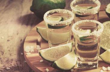 Silver Mexican tequila with lime and salt, selective focus
