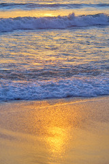 Calm ocean waves on the sand beach. Bali.