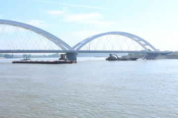 Fototapeta na wymiar Barges under Zezelj bridge on Danube