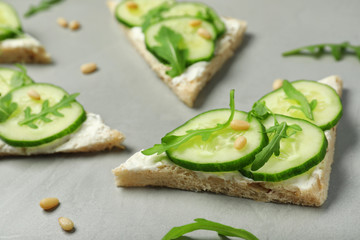 Plakat Traditional English cucumber sandwiches on grey table