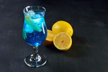 blue lagoon cocktail on dark background