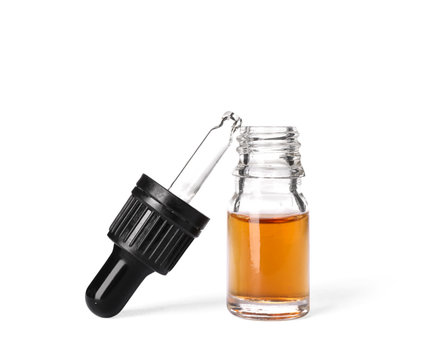 Cosmetic bottle and pipette with essential oil on white background
