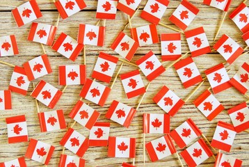 National day of Canada concept with flag on white wooden background top view