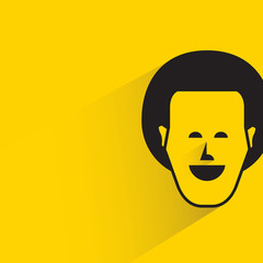 male face with shadow in yellow background