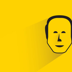 male face with shadow in yellow background