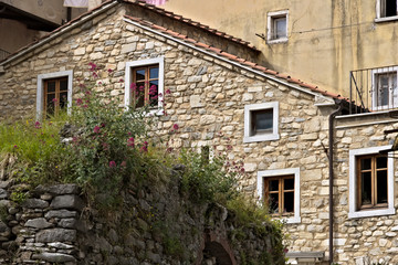 House with walls in white Carrara marble in the town of Colonnat