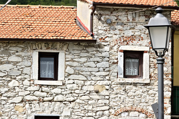 Fototapeta na wymiar House with walls in white Carrara marble in the town of Colonnata