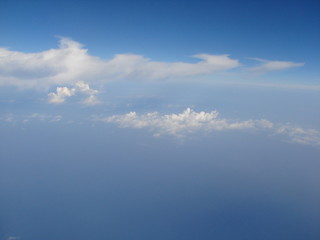 Panorama of cloudy sky with a height of 9000 m in flight above the Mediterranean Sea.
