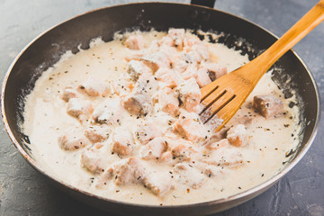 Salmon cream sauce on frying pan