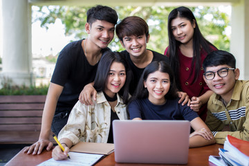 young people being used computer and tablet. education and technology concept.