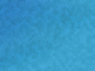 Blue textured canvas with slight ripple grunge effect 