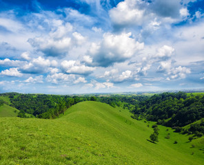 Fototapeta na wymiar green hills and beautiful sky