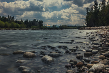 Bialka river in Poland with view of Tatras (Tatry) mountains in the background