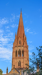 Fototapeta premium The church spire of St Paul's Cathedral in the city of Melbourne, Australia.