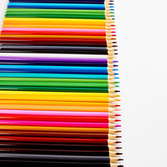 Fototapeta premium A set of colored pencils for drawing on white background