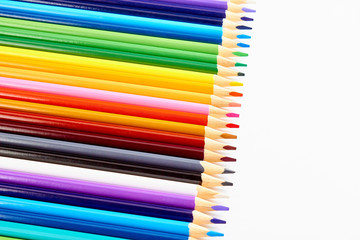 Fototapeta premium A set of colored pencils for drawing on white background