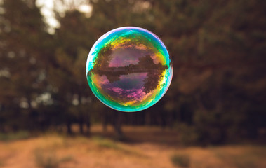 soap bubbles into the sunset with beautiful bokeh.close-up