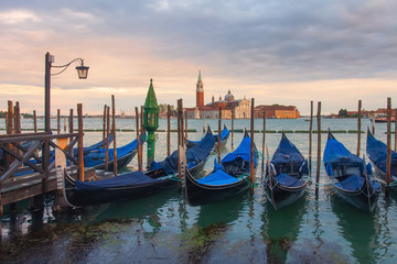 Gondolas in Venice view on San Giorgio Maggiore church from San Marco square in Italy