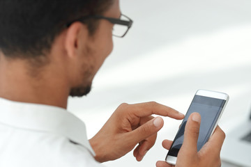close up. business men using a modern smartphone