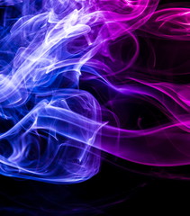 Colored smoke on black background