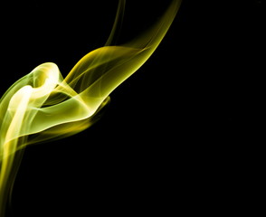 Yellow smoke on black background
