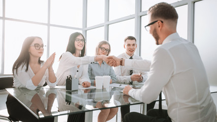 businesswoman shaking hands with the candidate for the vacant position