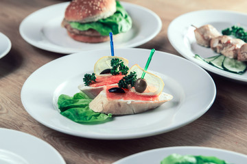 appetizer with salted salmon and other dishes on the table.